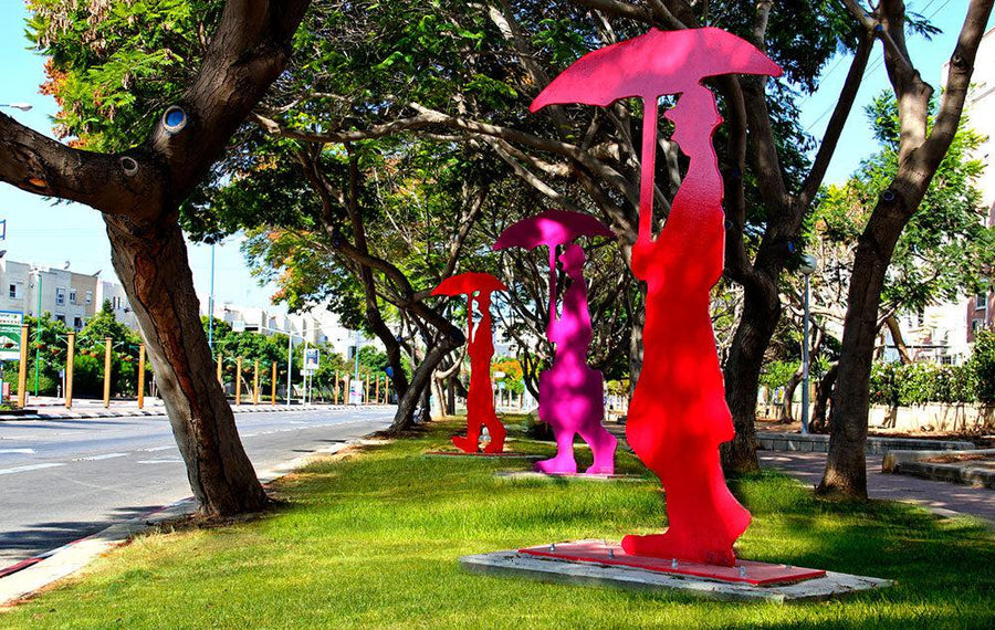 3 Figures with Umbrella